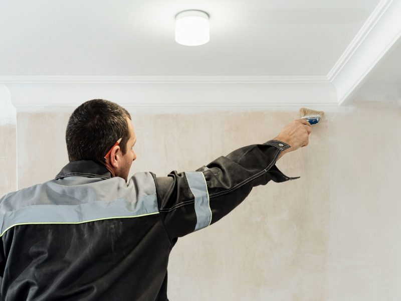 worker-applies-glue-walls-before-wallpapering-primer-walls-idea-renovation-restoration-apartments-selective-focus-brush-web
